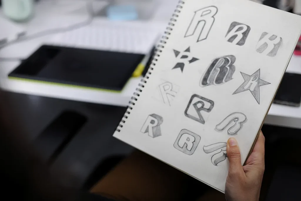 Close up of a designer refining vector shapes for a clean, modern custom logo